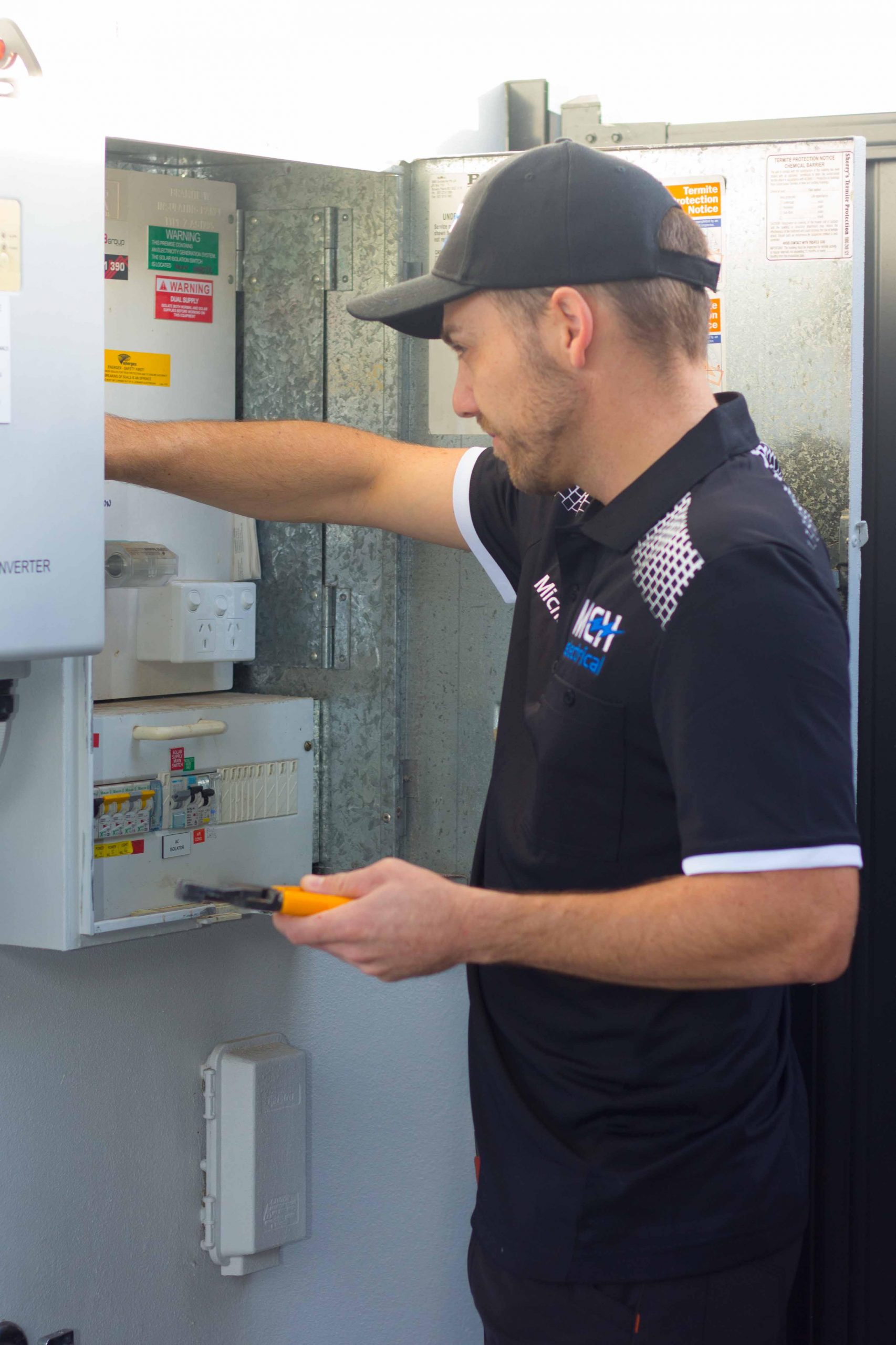 MCH Electrical electrician working on a home switchboard on the Gold Coast