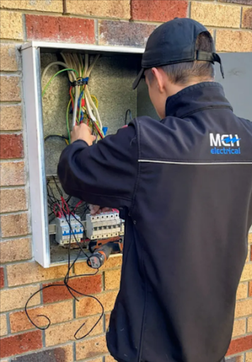 Our electrician in Gold Coast inspecting an electrical system